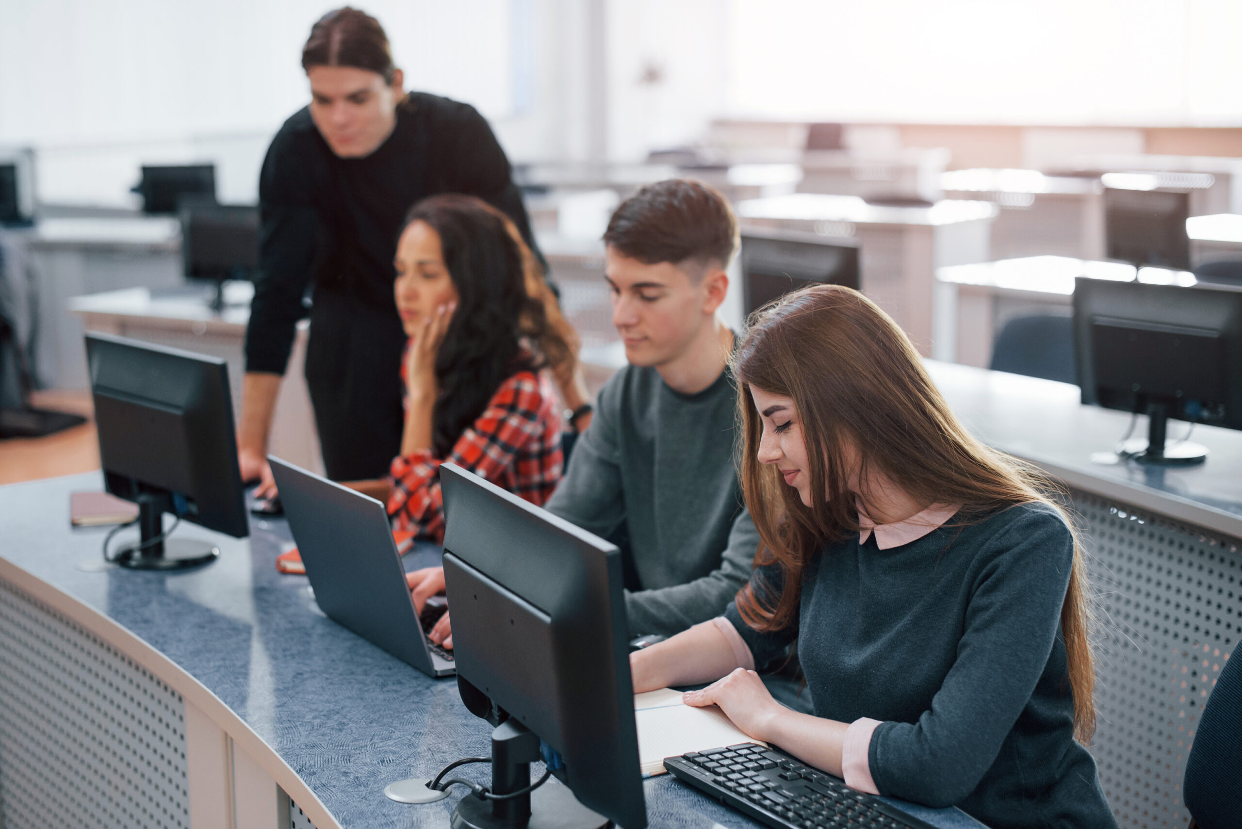 spacious area. group of young people in casual clothes working in the modern office